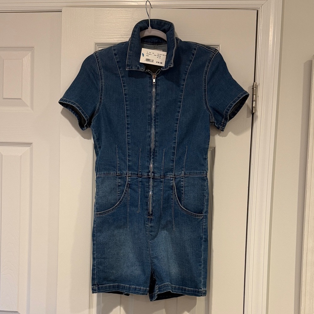 NWT. Cute jean romper with zipper and real pockets.
